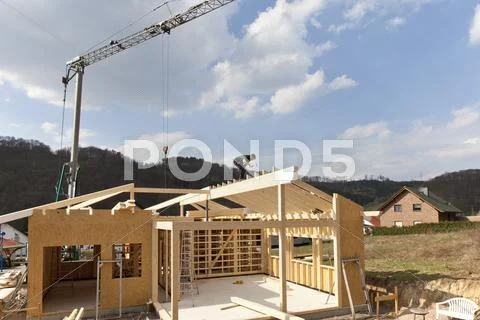 Europe, Germany, Rhineland Palantinate, Man installing and fixing wooden walls Stock Photos