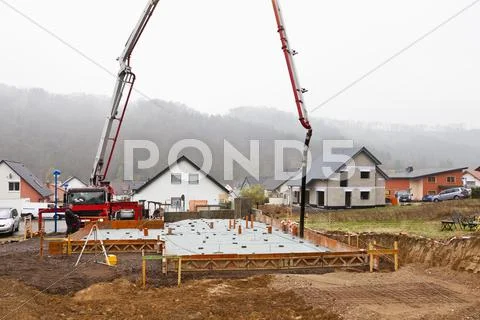 Europe, Germany, Rhineland-Palatinate, Construction workers filling concrete in Stock Photos