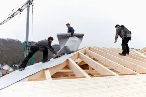 Europe, Germany, Rhineland Palatinate, Workers roofing on house Stock Photos