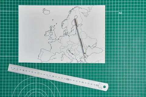 Europe map with a ruler and a cutter Stock Photos