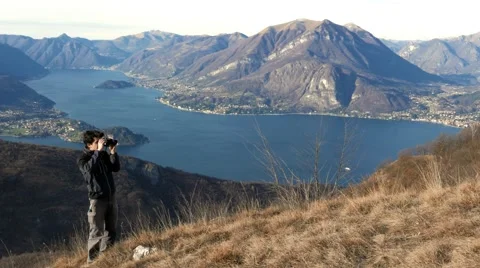 European boy looks at the view through the telescope Stock Footage 59556487