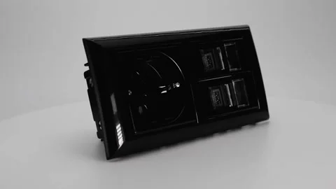 European electrical socket in black on a white background. Home electrician. Stock Footage 170779971