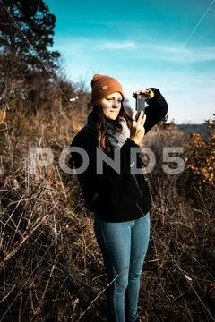 European female photographer searching for composition Stock Photos