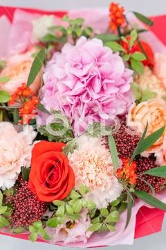 European floral shop. Bouquet Mixed beautiful flowers on wooden gray table. Nice Stock Photos