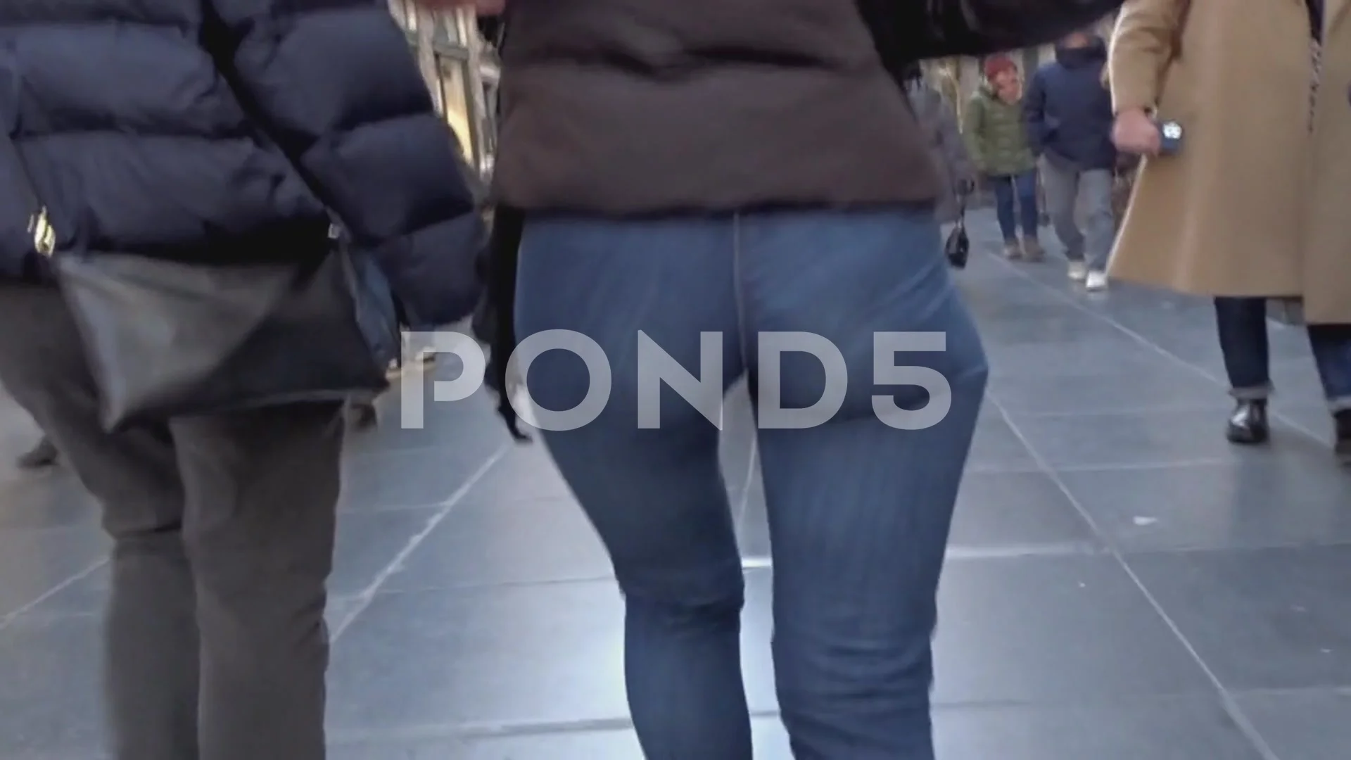 Blonde woman with sexy ass walking on the street