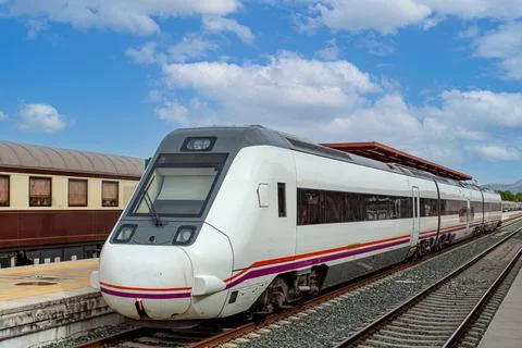 European High Speed passenger train arriving at the station in Ronda, Andalus Stock Photos