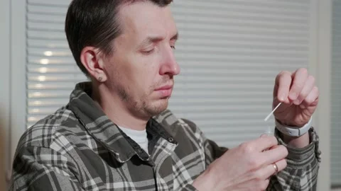 European man is using rapid antigen COVID-19 test Stock Footage 169044957