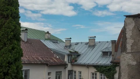 European Rooftops against Clouds Stock Footage 138984787
