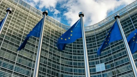 European Union flags waving in front of European Commission. Brussels, Belgium Stock Footage