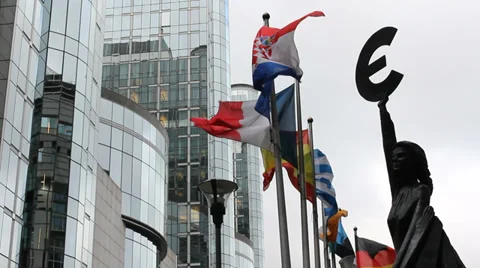 European Union representative statue, countries flags move, Parliament building Stock Footage 33289974