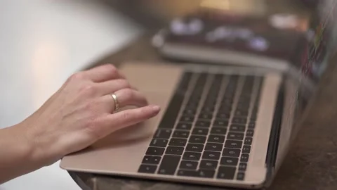 European woman's finger using a notebook touchpad. Stock Footage 147877460