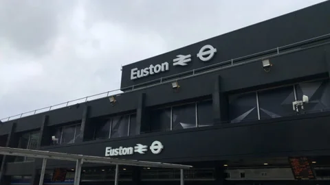 Euston Station facade, showing name and rail logos. London UK. Stock Footage 153769129