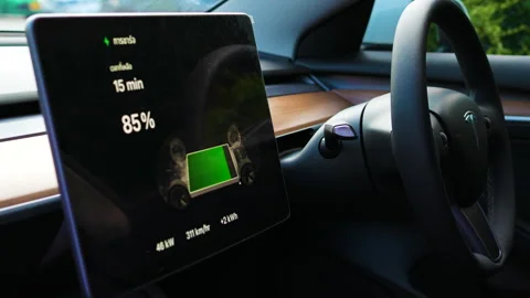 Ev car batterry charge screen inside car at electrict station Stock Footage 255123793