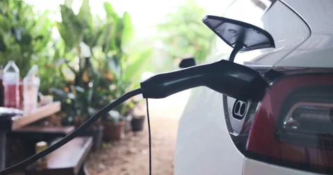 EV car charge parking at home zero emission Stock Footage 307664704