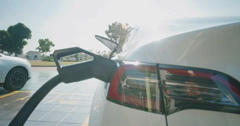 Ev car fast charge DC station sunset light zero emission Stock Footage 326093780