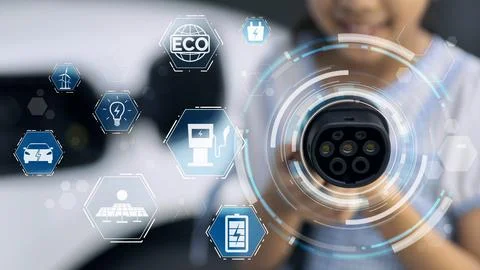 EV charger pointing in front of camera display hologram. Peruse Foto stock