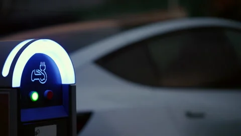Ev charging station illuminating blue light, indicating an available port for an Stockbeeldmateriaal 339809666