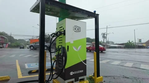 EV charging station by sidewalk and handicap parking in Orotina street Stockbeeldmateriaal 341723660