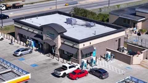 EV charging stations at Shell gas station in Elyria, Ohio, suburban aerial view Stock Footage 324793258