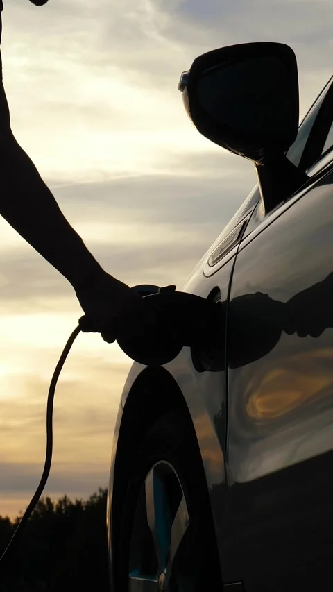 EV charging at sunset Stock Footage 307717602