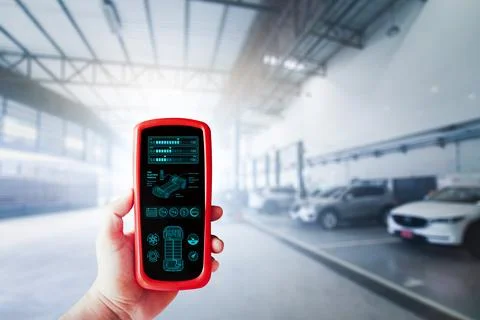 EV Electric vehicle checking tools in a technician hand Foto stock