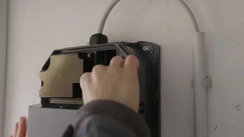 EV Wallbox Firmware Update: Inserting USB Drive and Pressing Reset Button Stock Footage 331162993