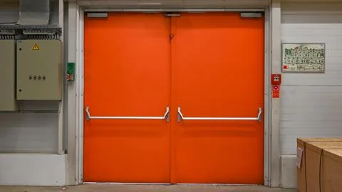 The evacuation exit is orange in the store. Stock Photos