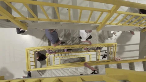 Evacuation of people walking down the emergency fire exit stairs after fire Stock-Footage 150051200