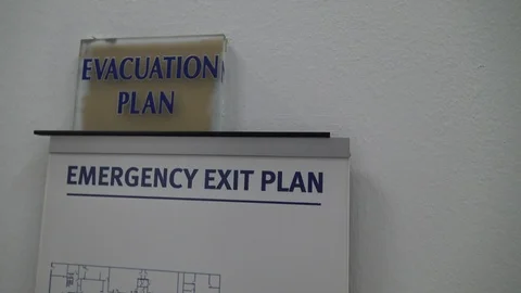 Evacuation plan emergency exit on wall Stock Footage 87350177