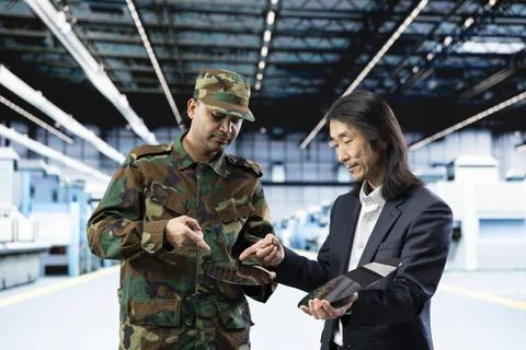 Evaluating hardware, microchip production and man with army personnel Stock Photos