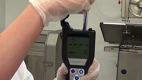 Evaluating Meat Freshness With a Meat Freshness Analyzer Stock Footage 320796922