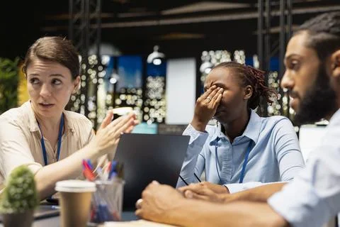Evaluating staff performance, layoffs and manager in office giving bad news Stock Photos
