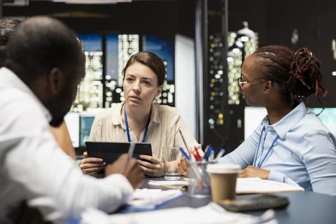 Evaluating staff performance, tablet and manager gathering employees in office Stock Photos
