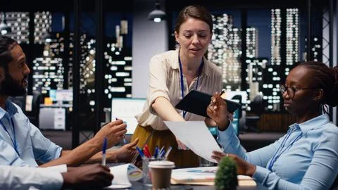Evaluating staff performance, tablet and manager gathering employees in office Stock Photos
