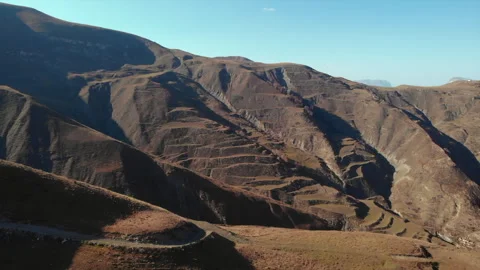 Evaluating structural stability of hillside switchback roads with aerial drone Stock Footage 321452404