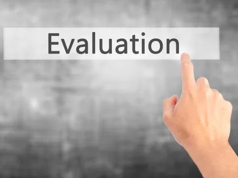 Evaluation - Hand pressing a button on blurred background concept on visual s Stock Photos