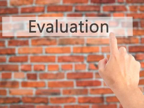 Evaluation - Hand pressing a button on blurred background concept on visual s Stock Photos