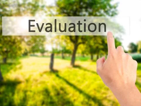 Evaluation - Hand pressing a button on blurred background concept on visual s Stock Photos