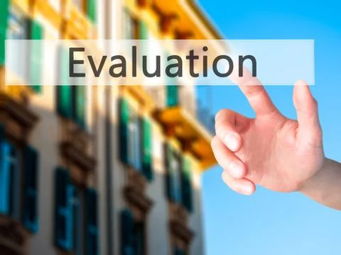 Evaluation - Hand pressing a button on blurred background concept on visual s Stock Photos