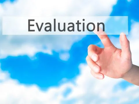 Evaluation - Hand pressing a button on blurred background concept on visual s Stock Photos