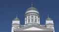 Evangelical Lutheran cathedral Helsinki Finland white church facade blue sky day HD Footage