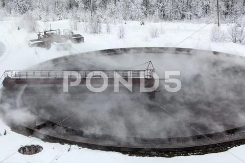 Evaporation in sewage settlers in winter season Stock Photos