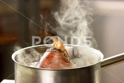 Evaporation from water with pork knuclke. Stock Photos