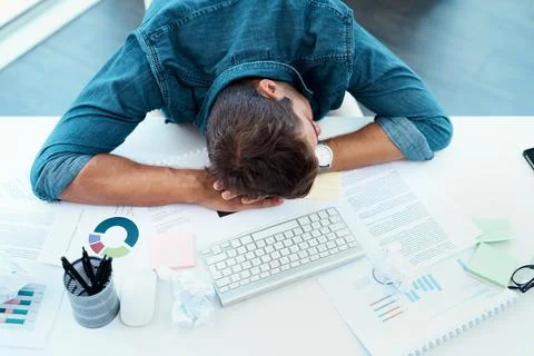 Even he needs to refresh every now and then. High angle shot of an exhausted  Stock Photos
