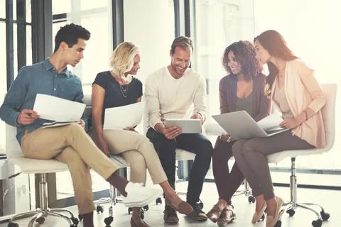 Even the simplest ideas can be transformed into something bigger. a team of Stock Photos