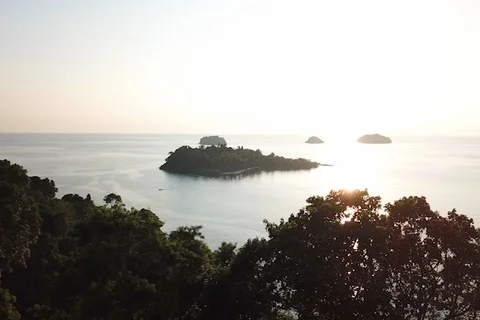 Evening aerial view of Koh Man Nai island from Koh Chang, in Thailand Stock Footage 89456435