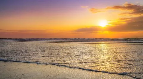Evening and sunset on the beach Stock Photos