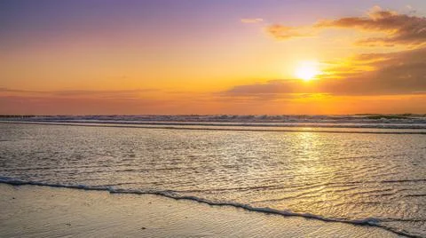 Evening and sunset on the beach Stock Photos