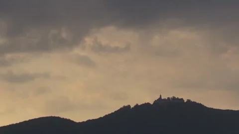 Evening atmosphere with clouds over forest and tower Stock Footage 315162956