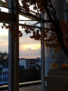 The evening atmosphere seen from inside the building Фото